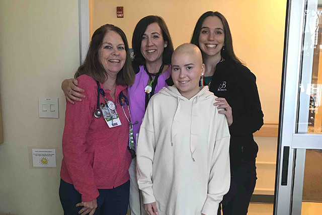 Ava during treatment for ALL with her care team