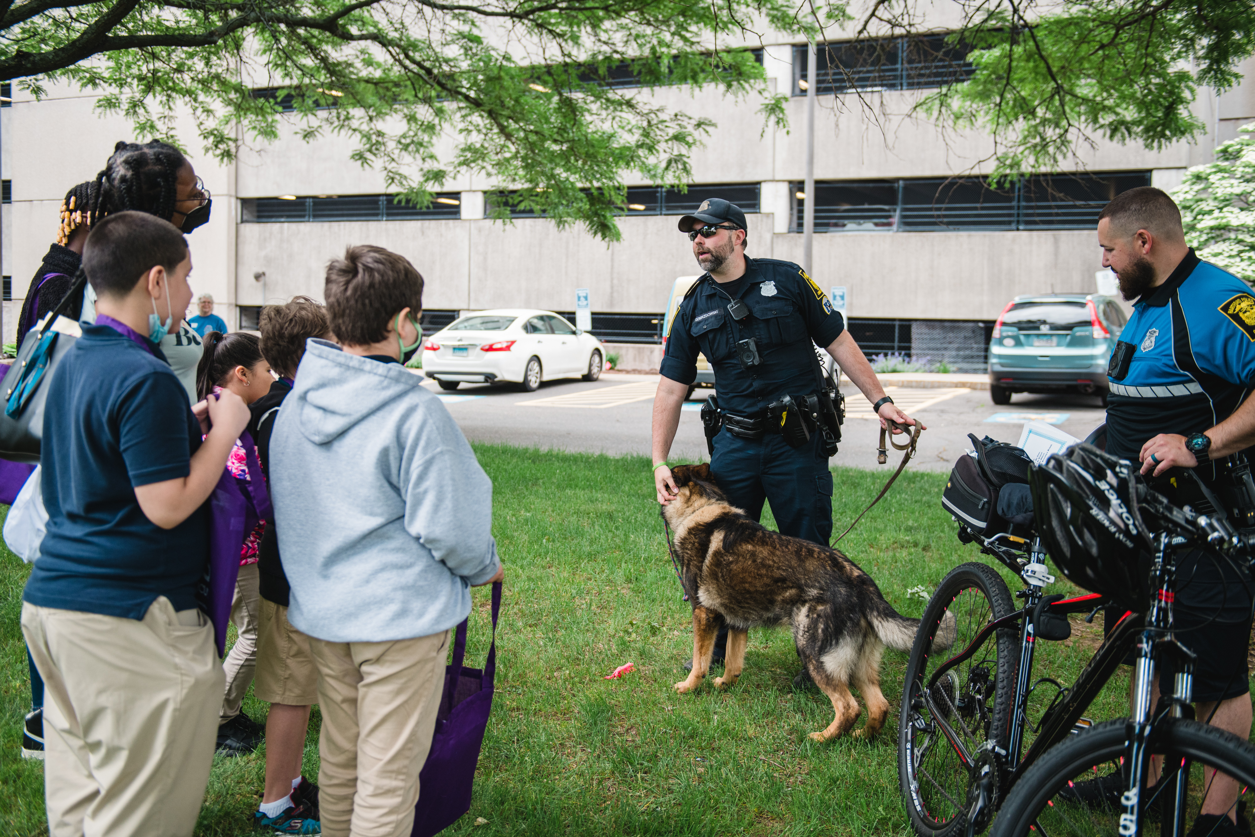 A Hartford Police K-9 Officer talks to students