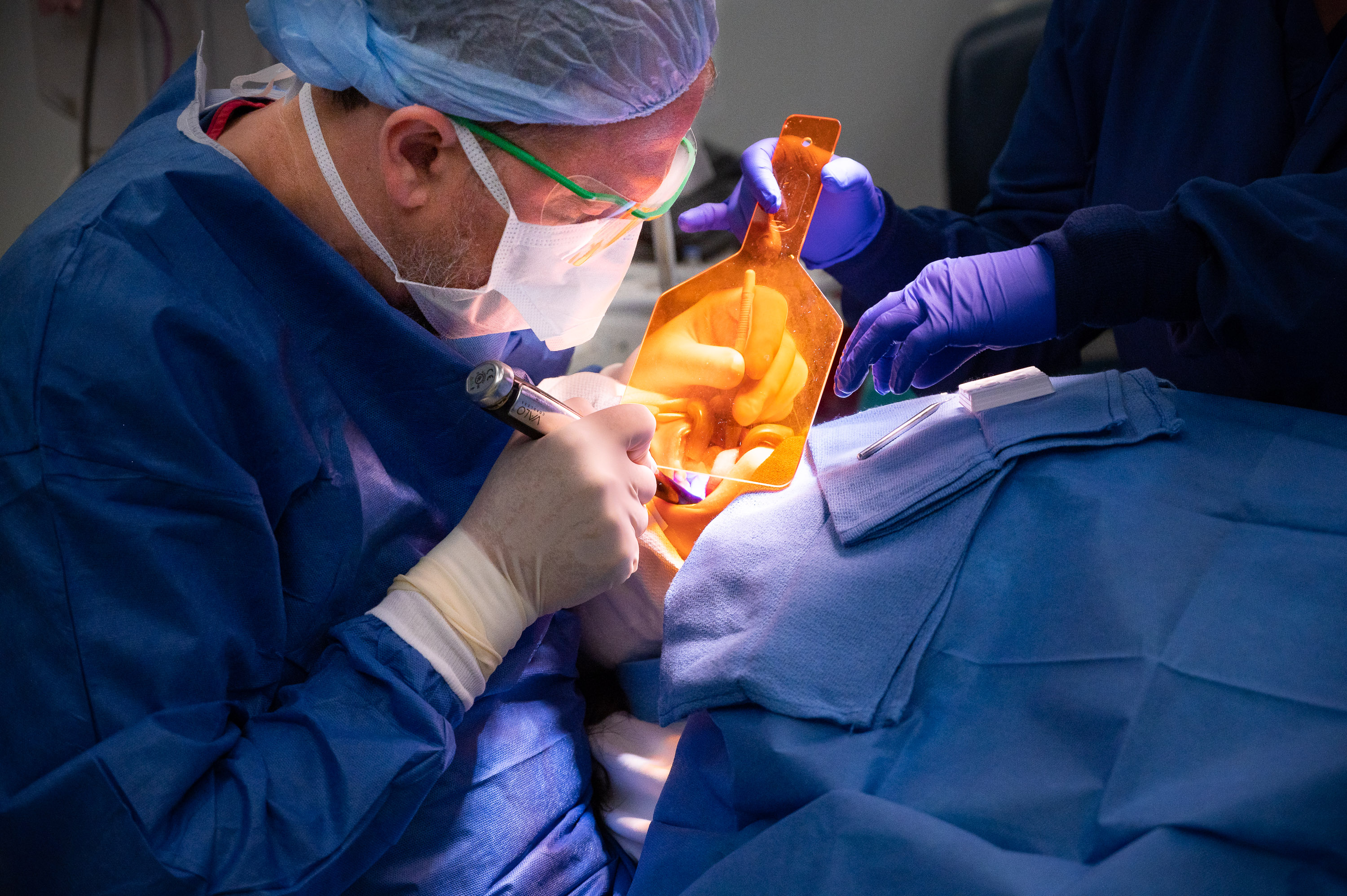 Ammar Idlibi, DMD, a pediatric dentist, performs a surgical procedure.