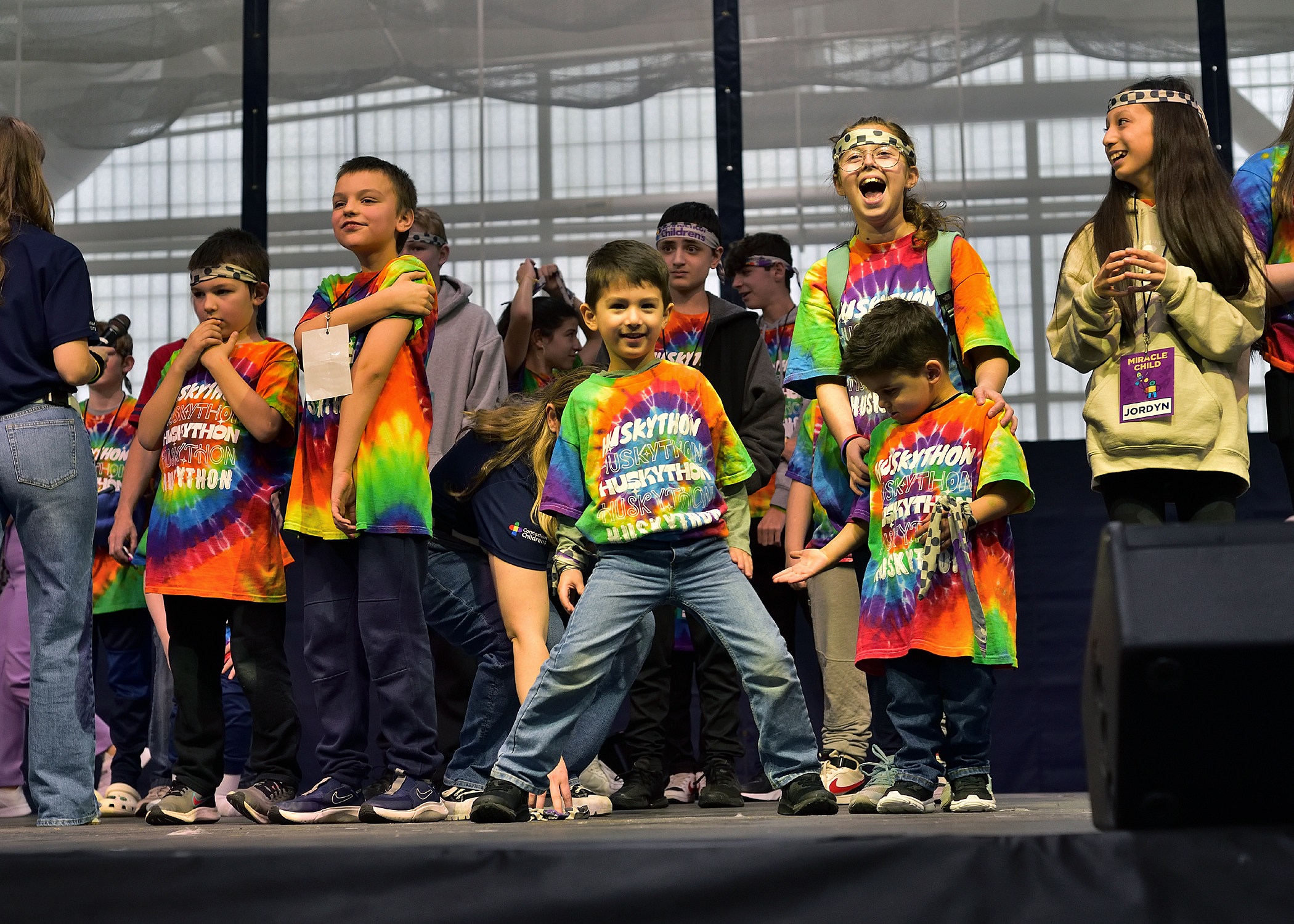 Kids dancing on stage at HuskyTHON 2023