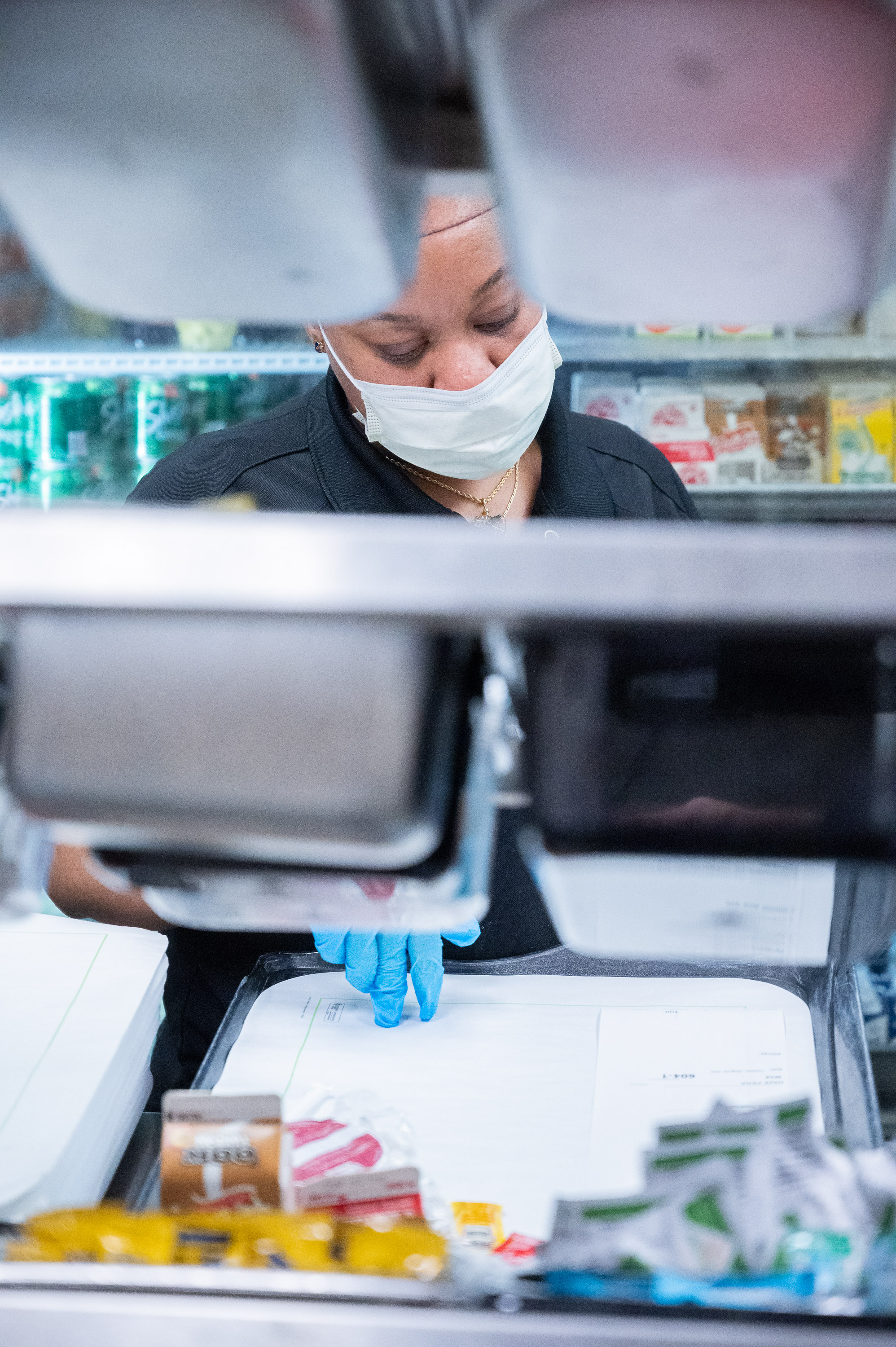 A food services team member double checks the patients order and dietary specifications before the meal is delivered.