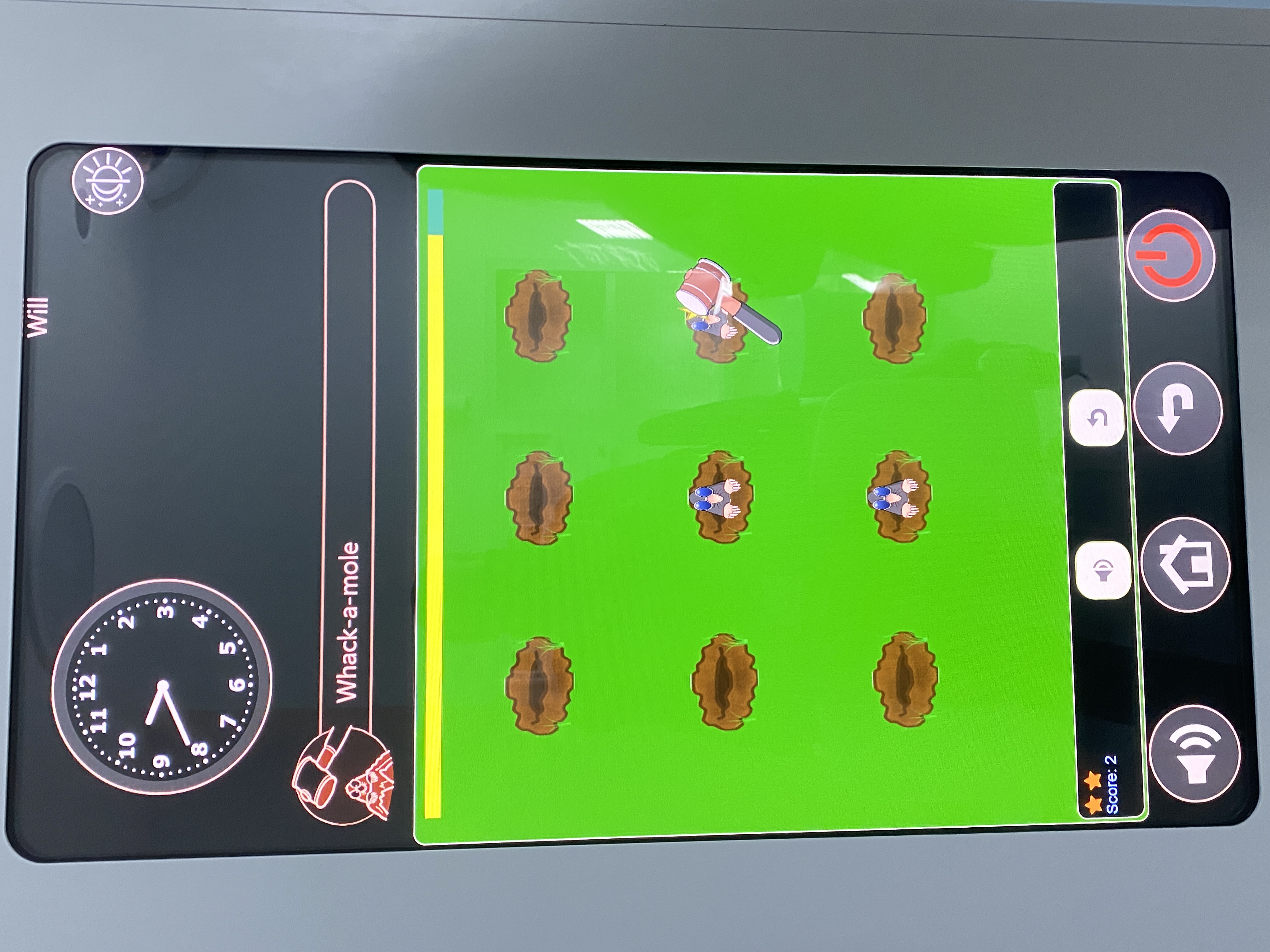 Whack a Mole being played on a CoWin Media Wall