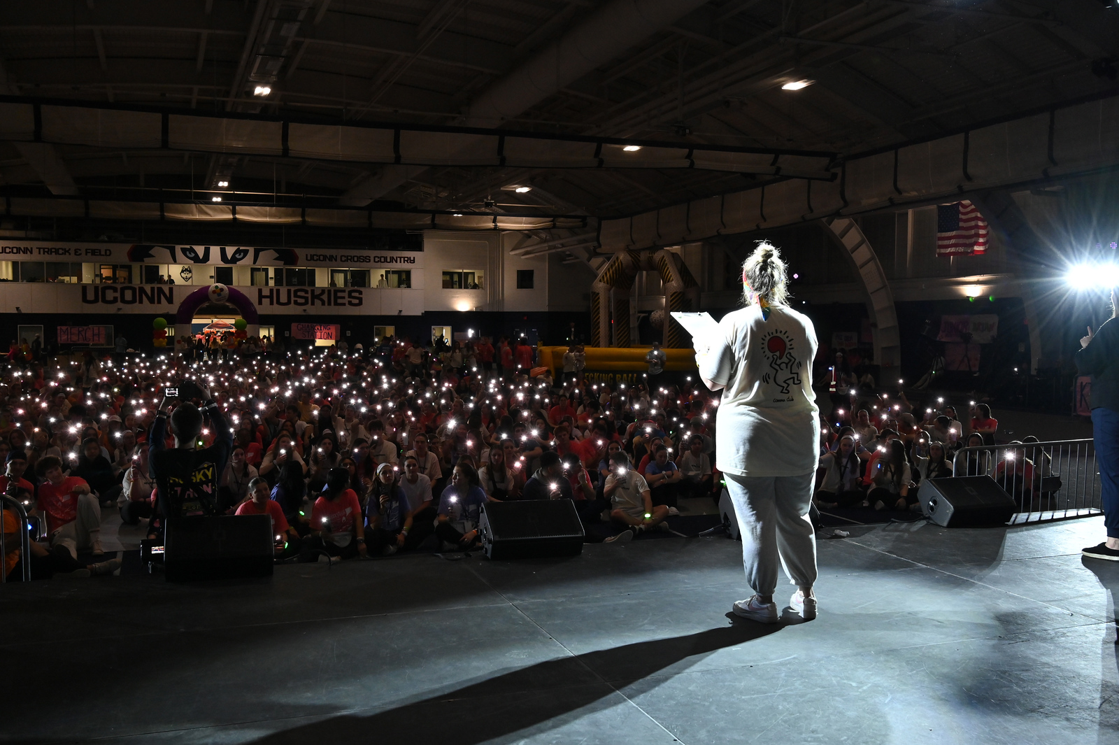 A parent shares their family's story with HuskyTHON attendees.