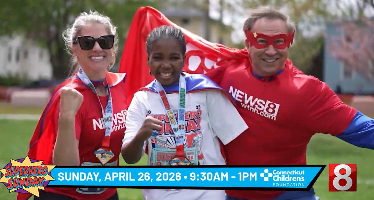 Laura and Dennis from WTNH smiling with patient Nate