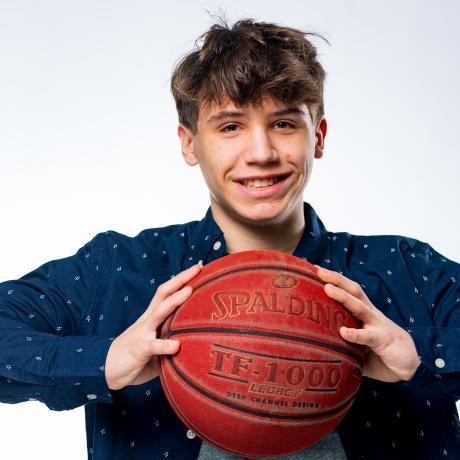 Ben Benard holding a basketball