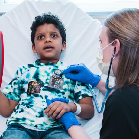 A child receives an exam in the Emergency Department.