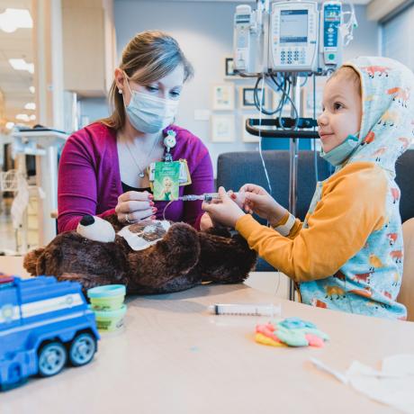 Child Life Specialists simulate procedures with toys to make kids feel more comfortable.