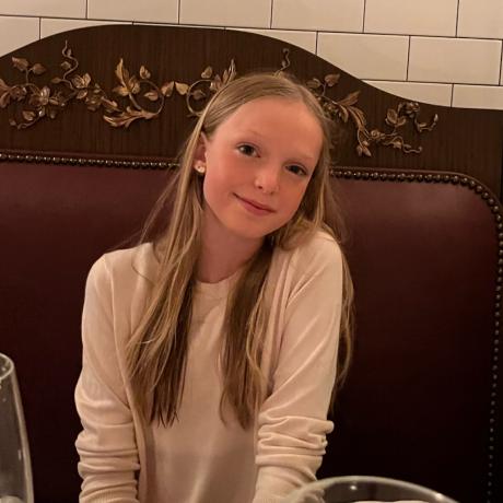 Chloe smiling in restaurant