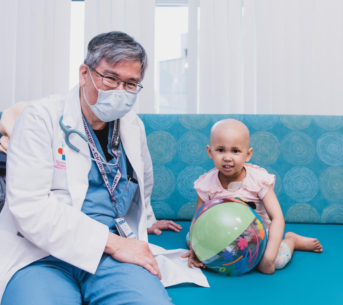 Dr. Lau with Abby, a patient at the Center