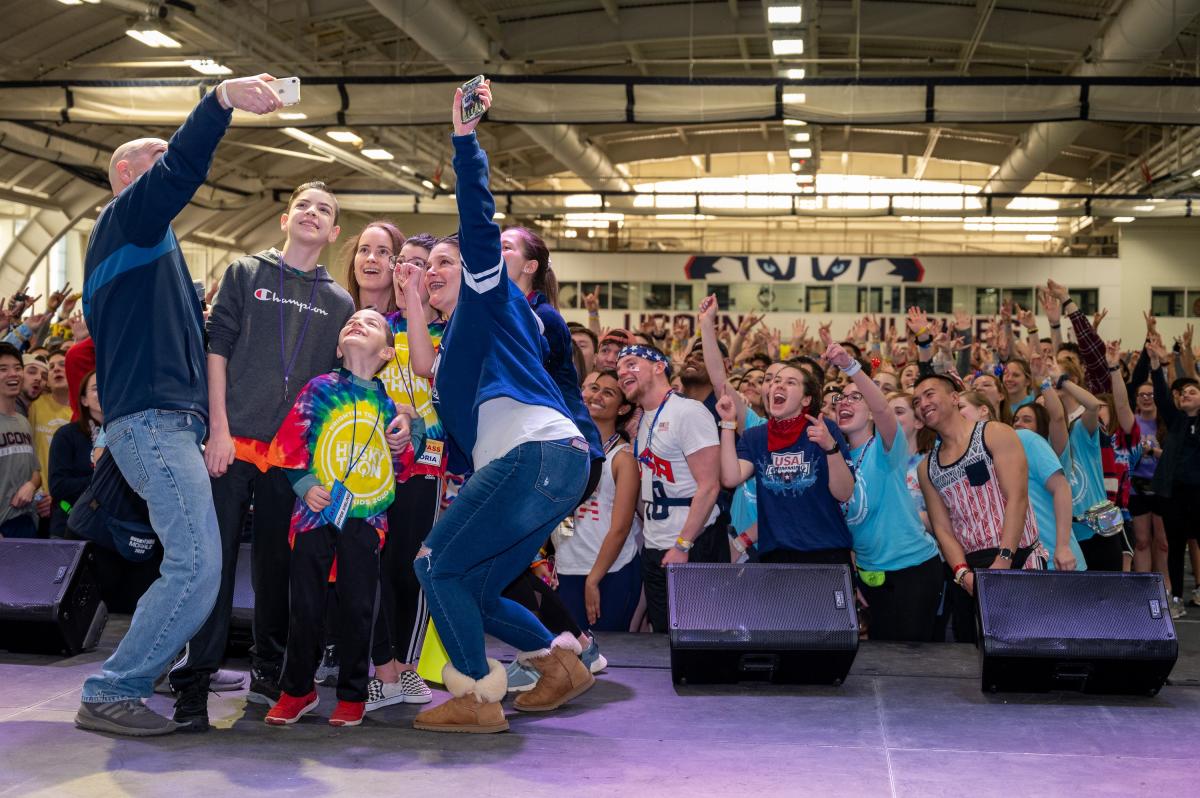 Family takes a selfie at Huskython after sharing their story