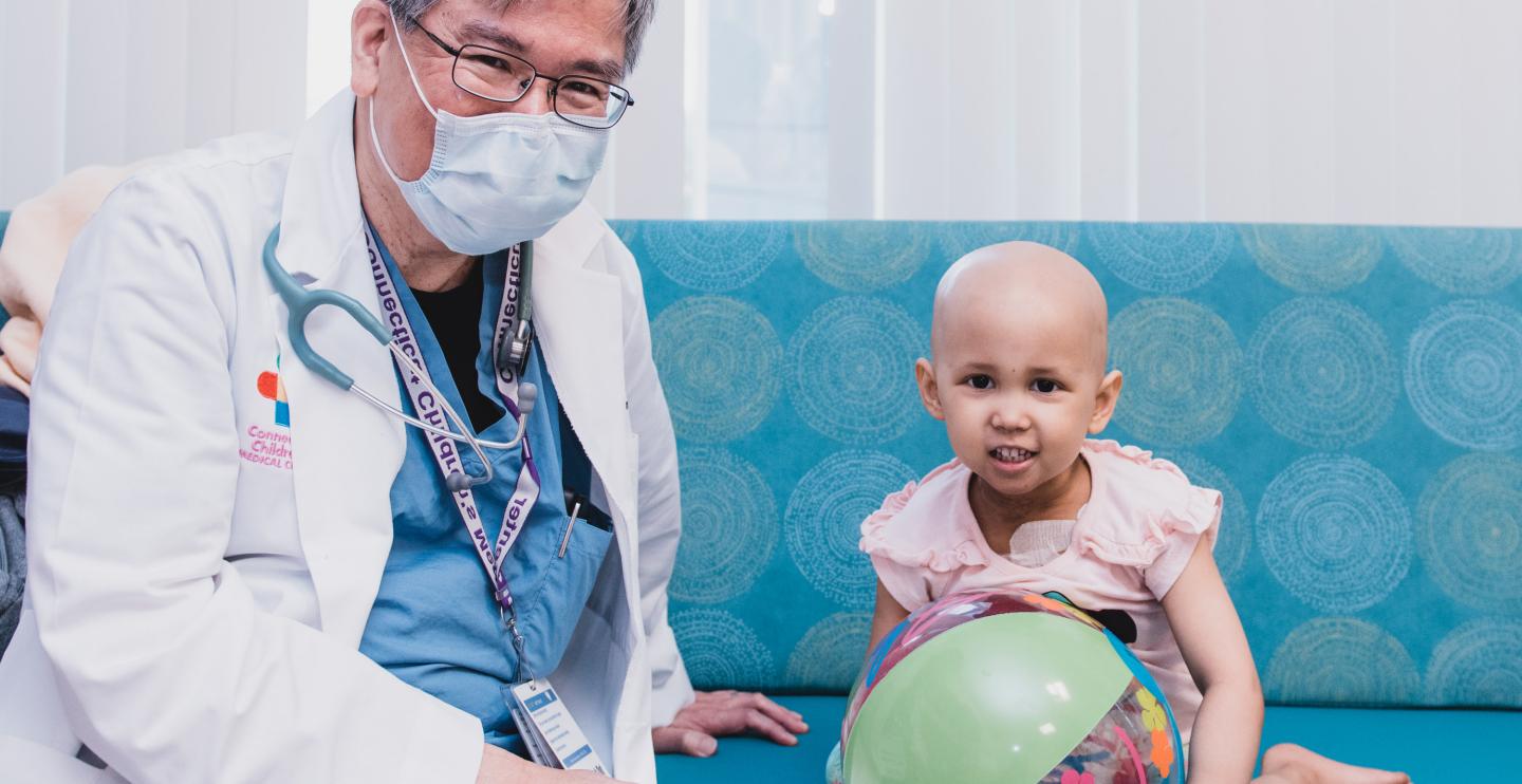 Dr. Lau with Abby, a patient at the Center