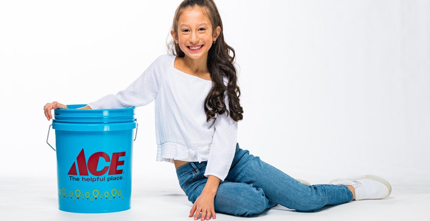 Jordyn Ty poses with an Ace Hardware bucket