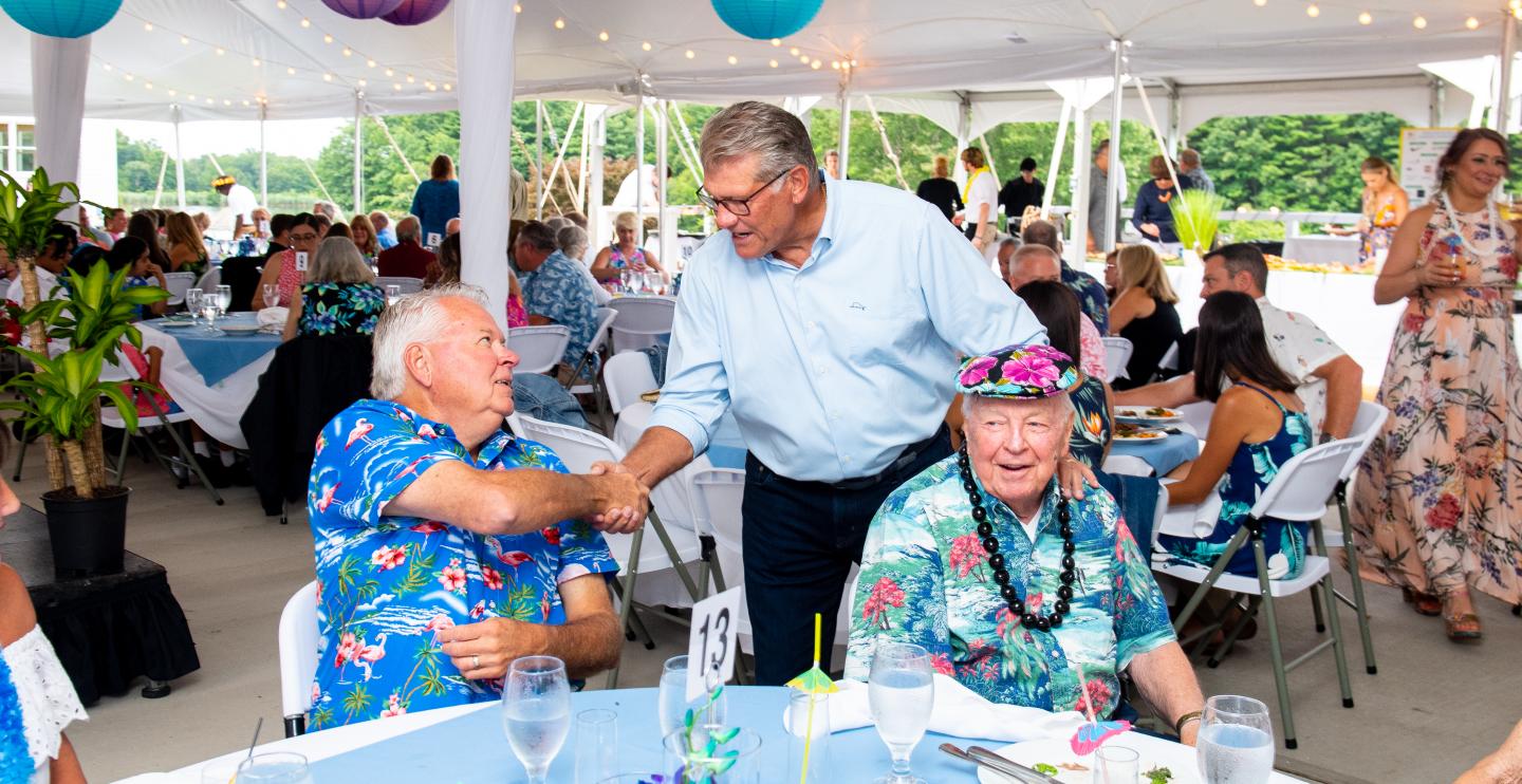 Geno greets guests at the Geno for the Kids Island Theme Dinner