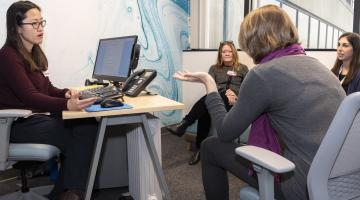 Transitions Clinic staff interview a parent